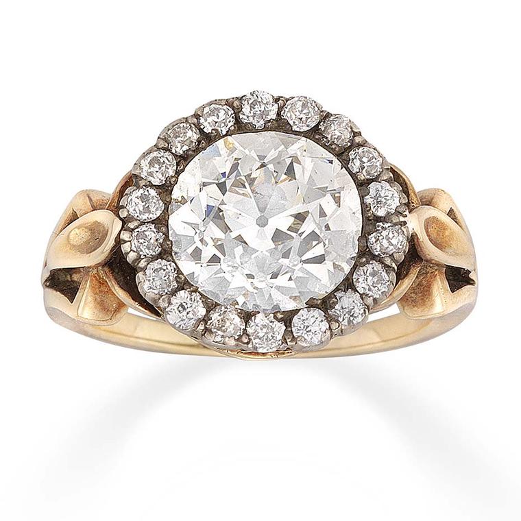 Bentley & Skinner diamond cluster Victorian engagement ring, dating from circa 1890, set with a large old-cut diamond in the centre of a gold mount, framed by old brilliant-cut diamonds.